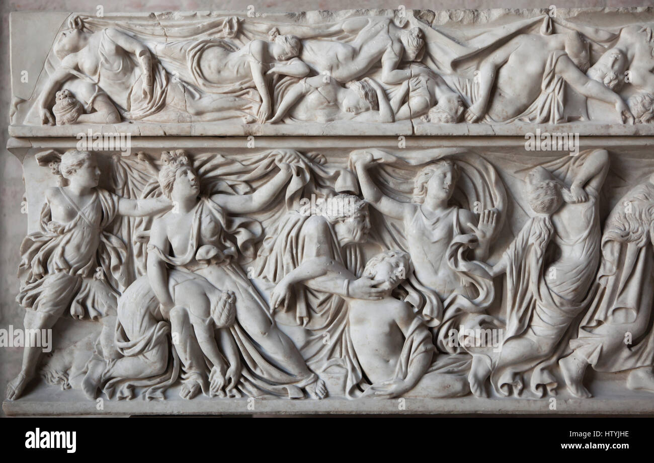 Massacre of the Niobids. Apollo and Artemis killing the fourteen children of Niobe. Roman sarcophagus from about 150 AD on display in the Glyptothek Museum in Munich, Bavaria, Germany. Detail: Artemis killing five daughters of Niobe with a nurse. Stock Photo