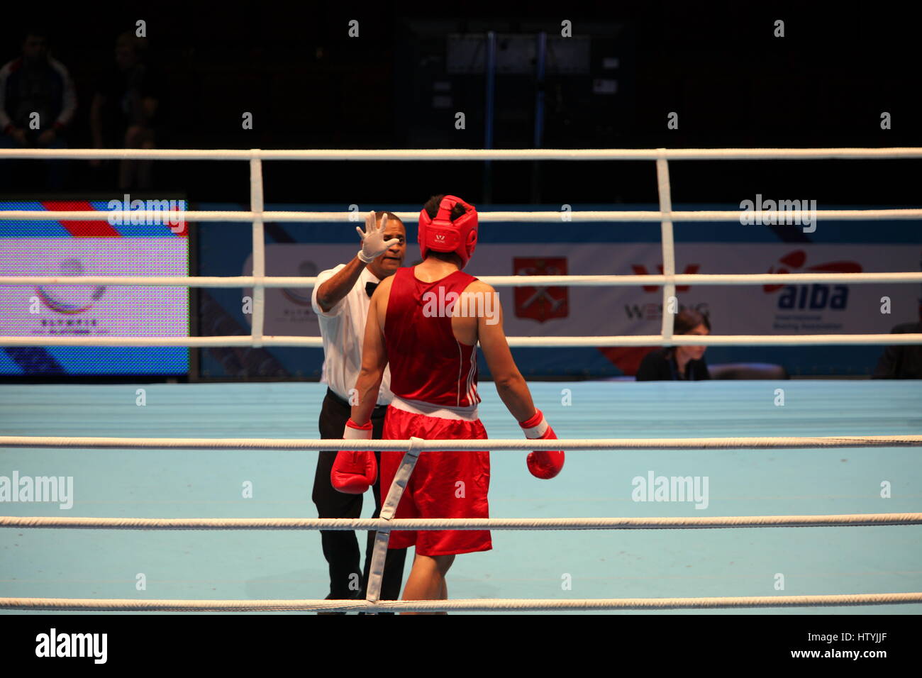 Boxing referee counting boxer knockout Stock Photo