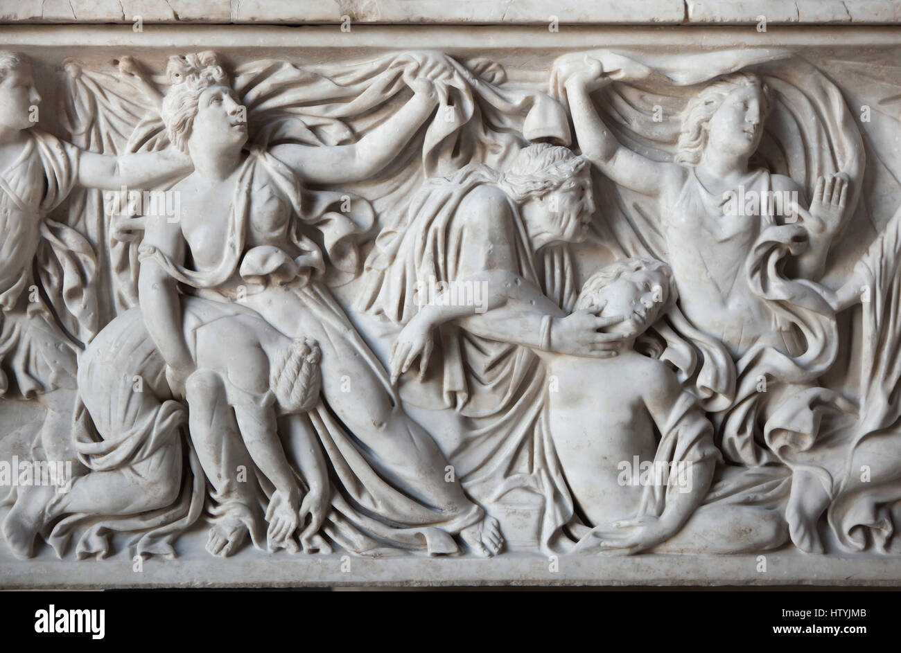 Massacre of the Niobids. Apollo and Artemis killing the fourteen children of Niobe. Roman sarcophagus from about 150 AD on display in the Glyptothek Museum in Munich, Bavaria, Germany. Detail: Four daughters of Niobe with a nurse. Stock Photo