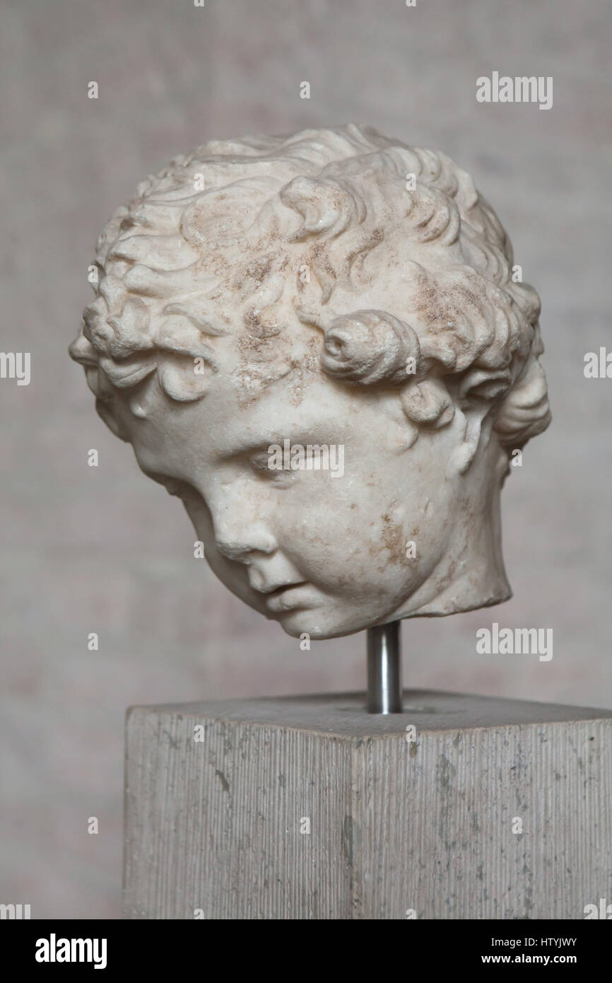 Head from a Greek statue of a boy, probably Eros, from about 280 BC on display in the Glyptothek Museum in Munich, Bavaria, Germany. Stock Photo
