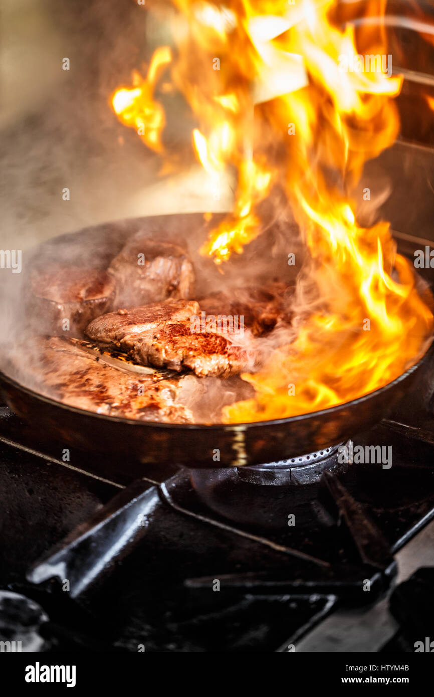 Pan on fire hires stock photography and images Alamy