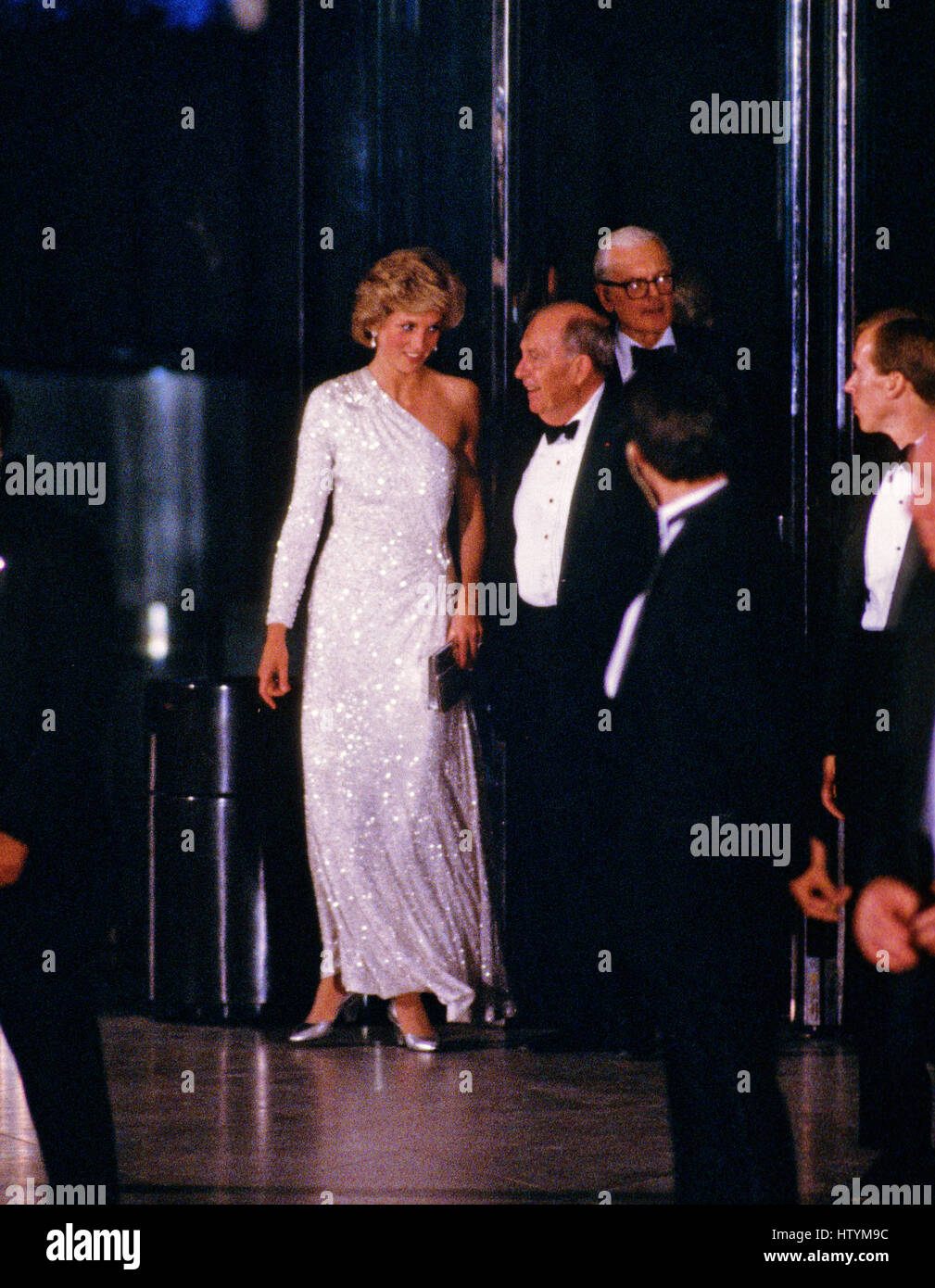 Princess Diana departs the National Gallery of Art in Washington, DC following an evening dinner and reception accompanied by Dr Franklin Murphy, Board Chairman of the National Gallery of Art, and John Stevenson, President of the National Gallery of Art, Stock Photo