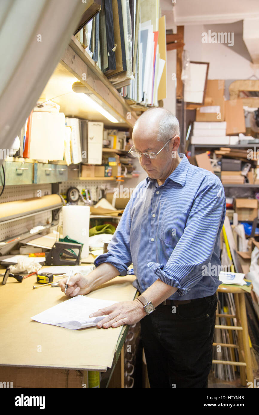 Frame shop owner Stock Photo Alamy