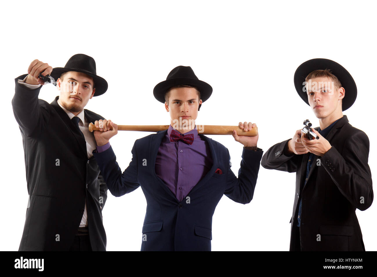Three guys in fancy suits with weapons Stock Photo Alamy