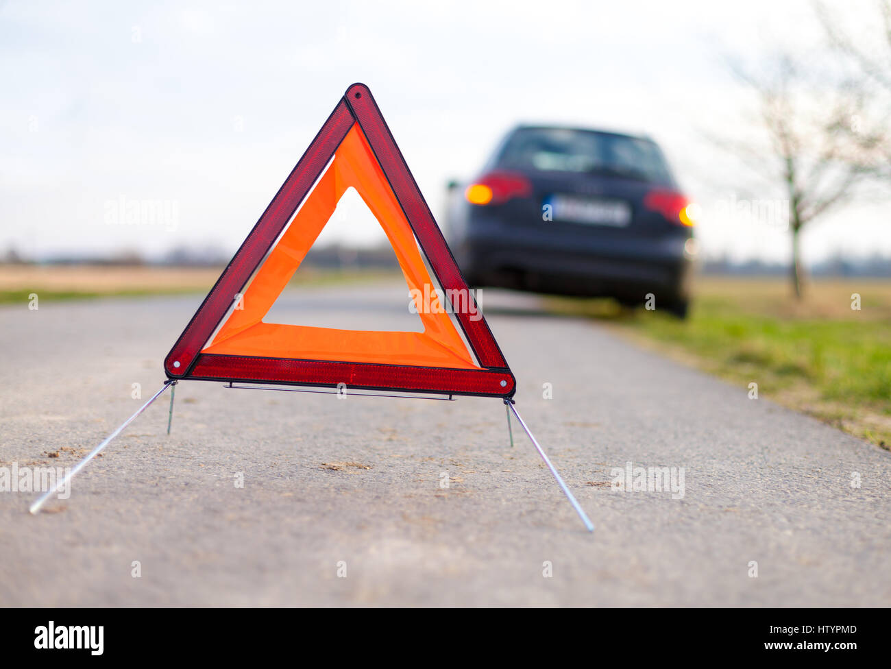 breakdown triangle stands near a broken car Stock Photo - Alamy