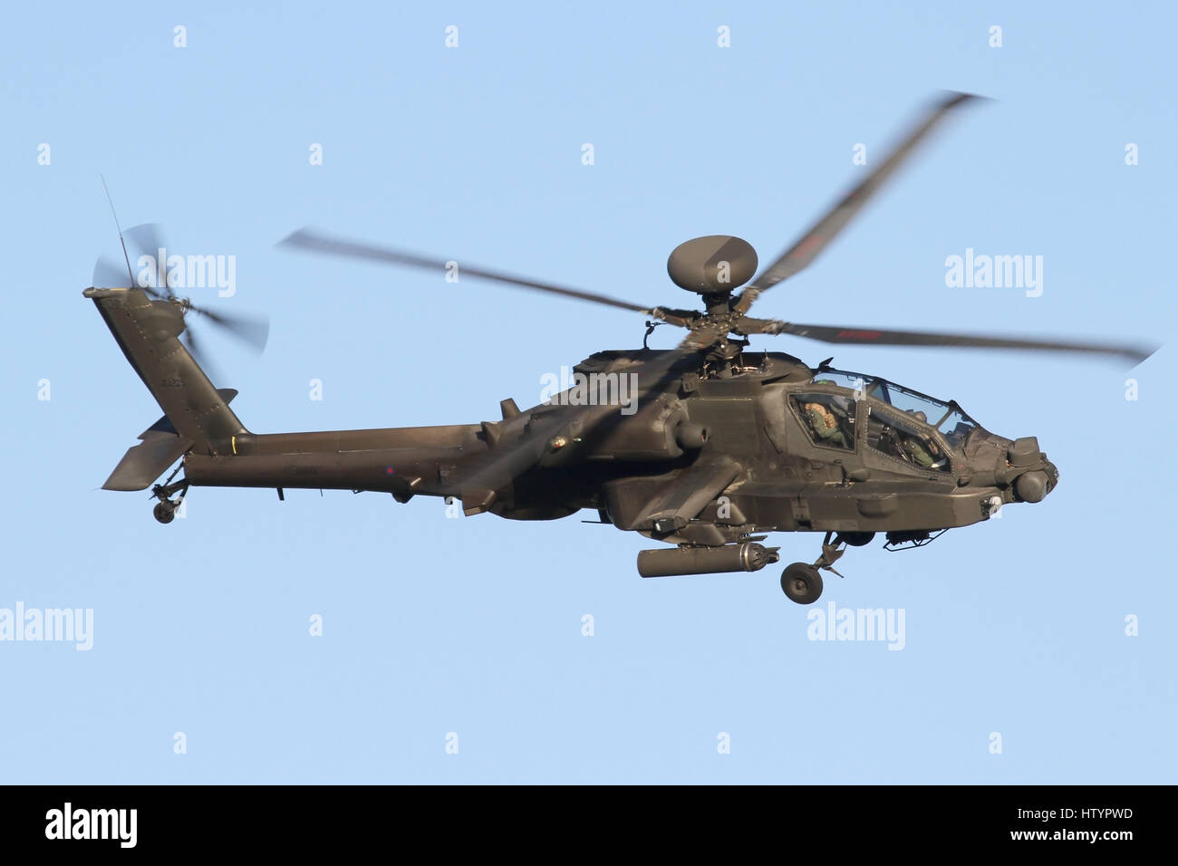 Army Air Corps Apache AH1 turning in for landing at Wattisham airfield. Stock Photo