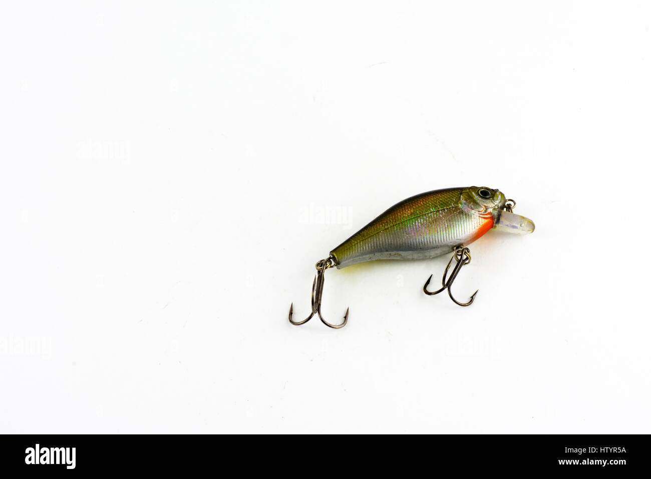 Set of metal lures for fishing shot on white surface Stock Photo - Alamy