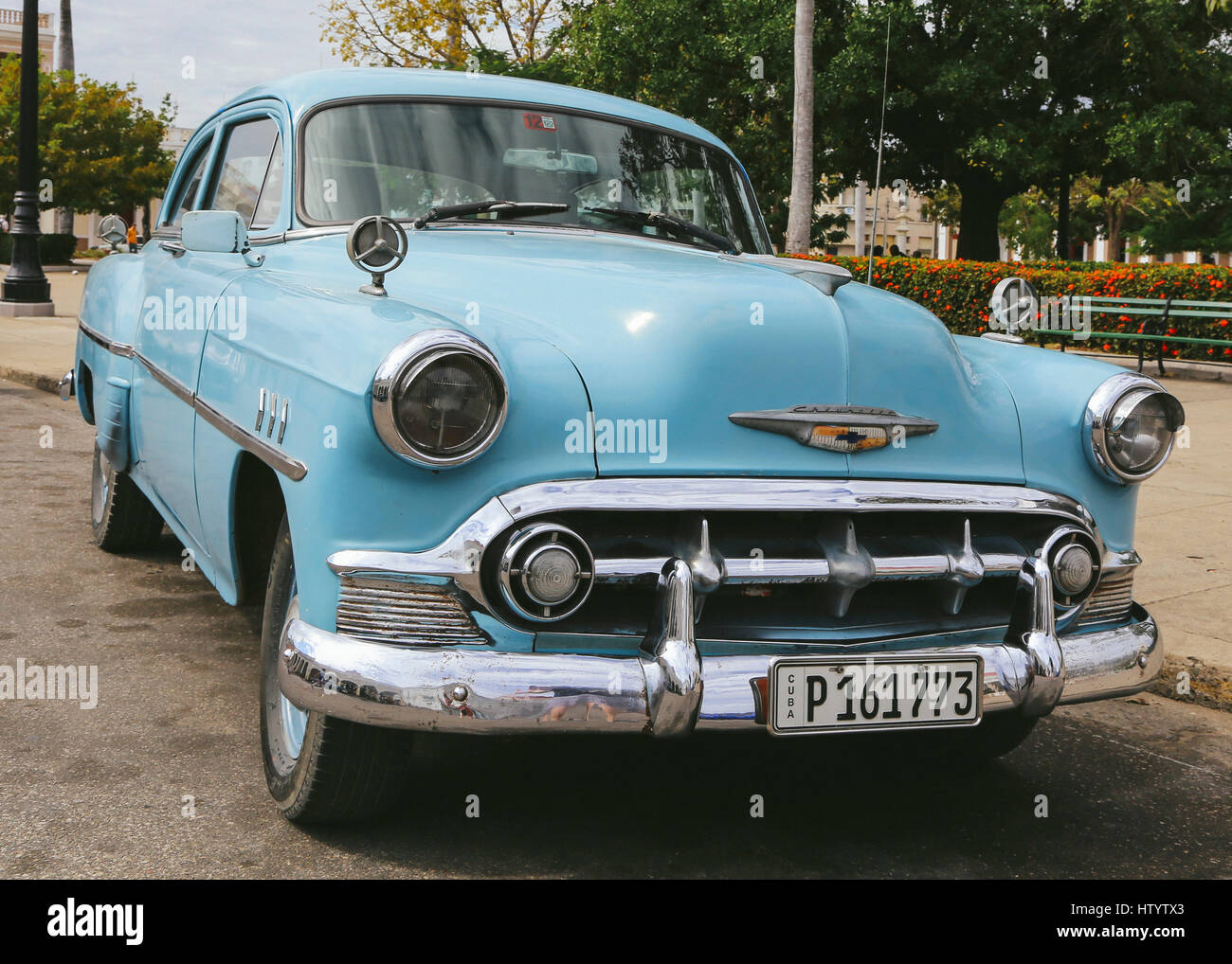 A classic blue Chevrolet car parked on the road in the town of Cienfuego, Cuba Stock Photo