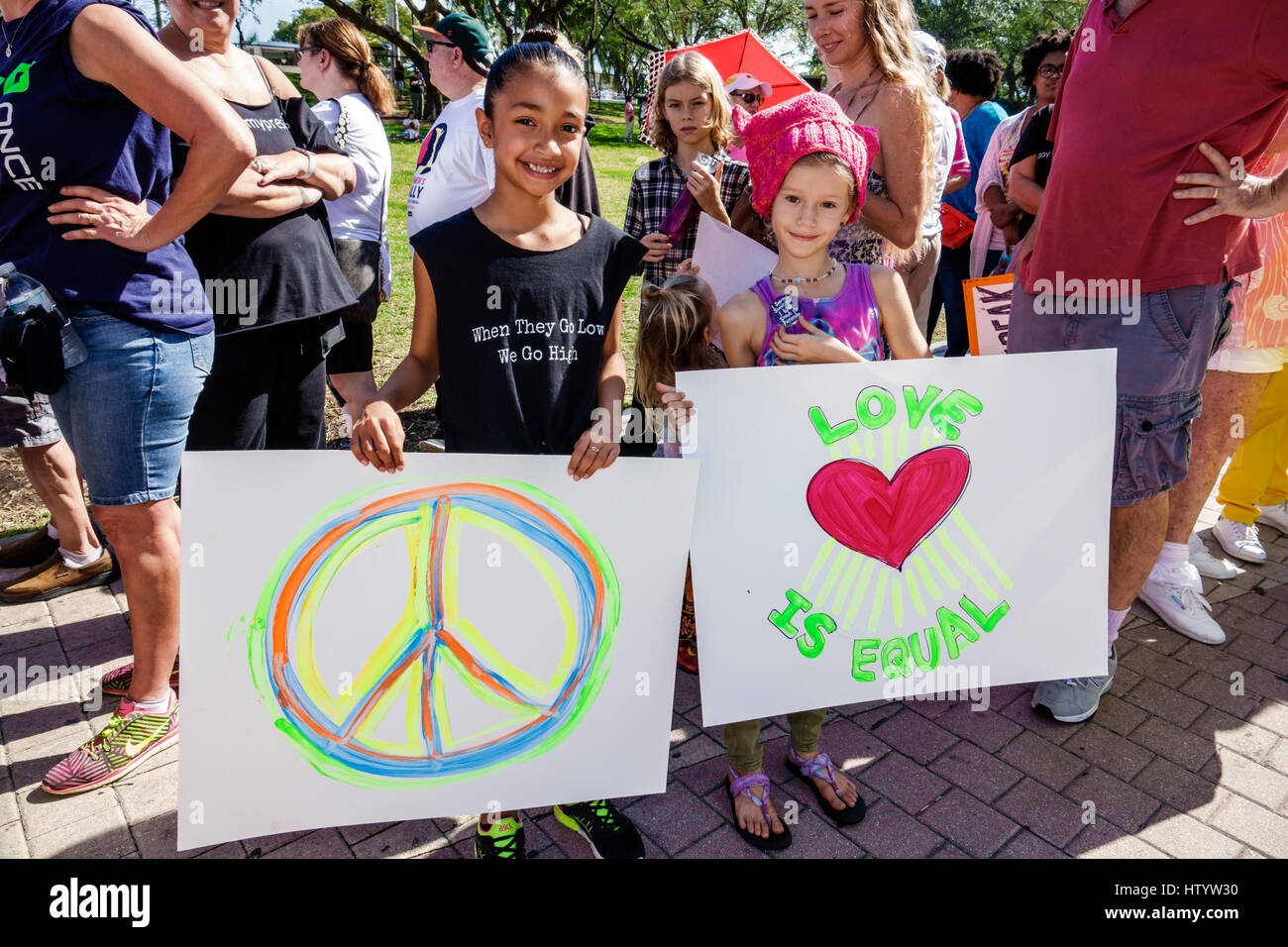 Miami Florida,Downtown,Bayfront Park,Women's March,political protest,march,human rights,advocacy,sign,Black. girl,holding sign,protesters,peace symbol Stock Photo