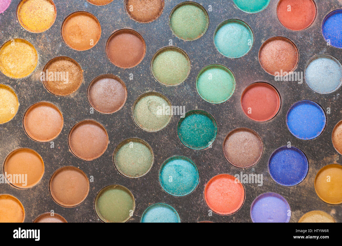 Closeup detail of multi colored color palette with eye shadow makeup cosmetics in beauty salon Stock Photo