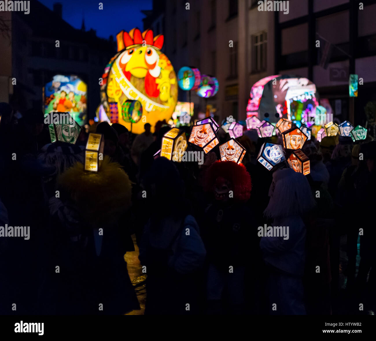 Basel carnival 2017. Colorful small mask lanterns and main lanterns on monday morning in the streets during the Morgestraich parade. March 6 - 2017. Stock Photo