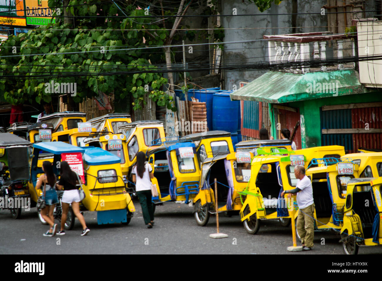 Tricycles awaiting passengers,Quezon Avenue, Legazpi City, Philippines