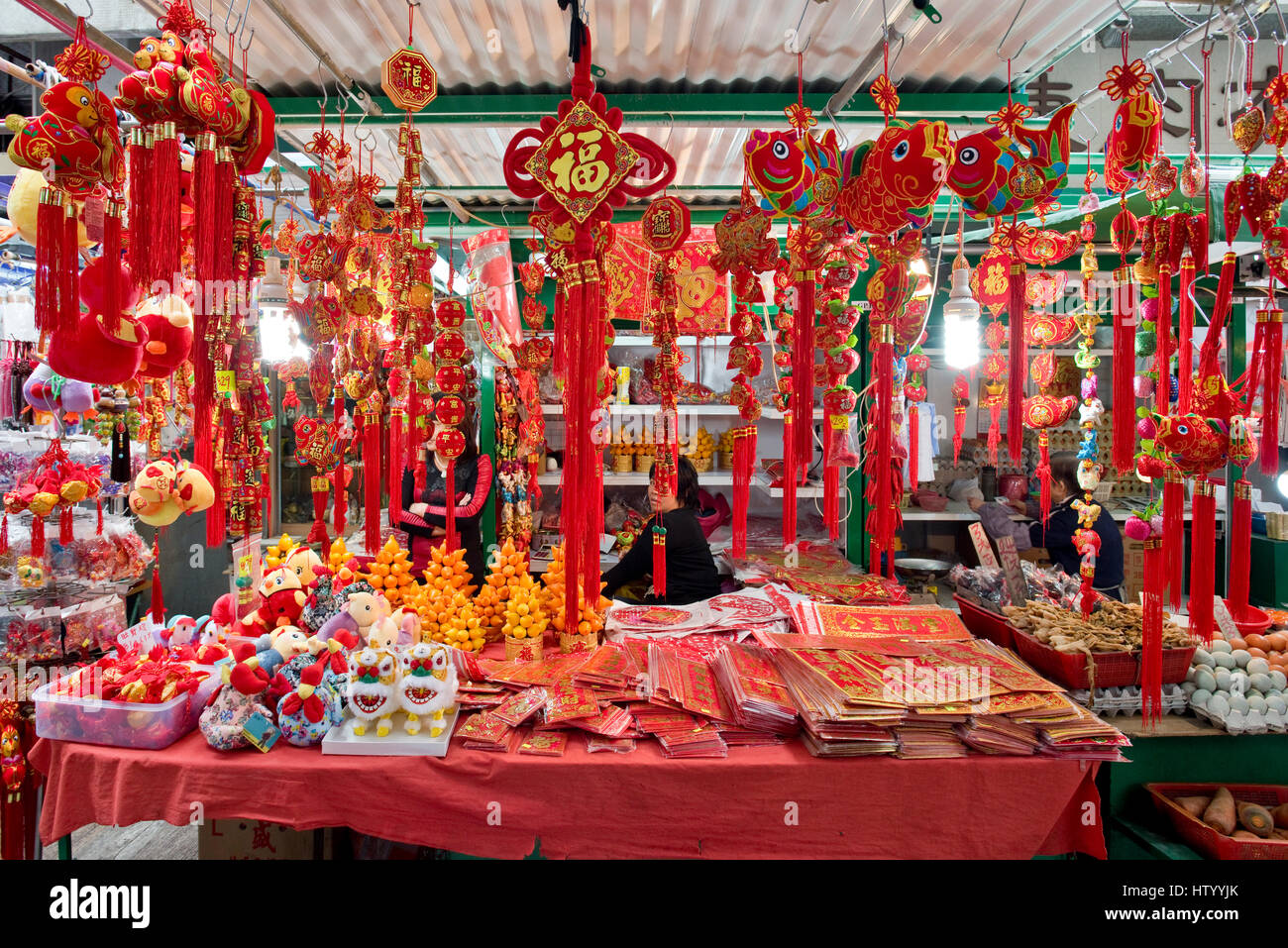 Chinese new year decorations hanging up for sale at a market in ...