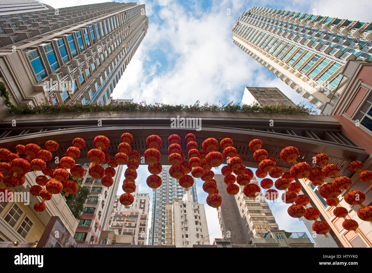 Traditional Chinese new year decorations hanging up in a street in Hong Kong. Stock Photo