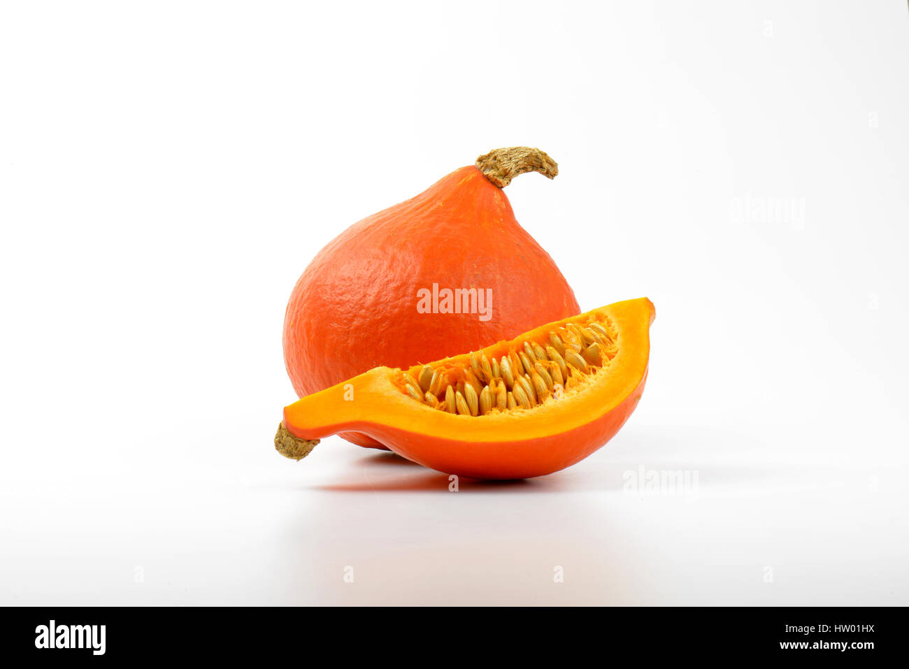 one and quarter of pumpkins on white background Stock Photo