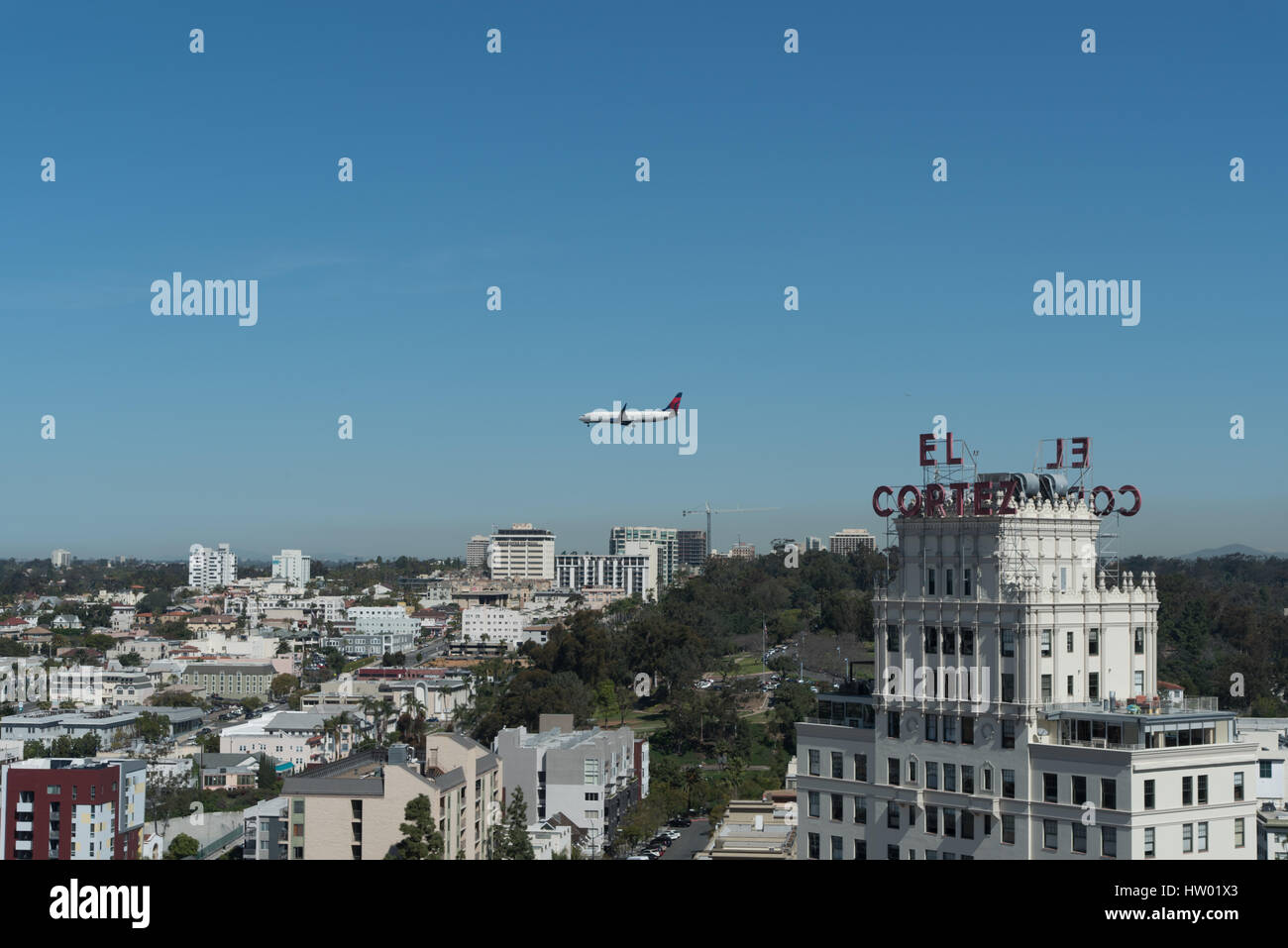 Airplane flying over the downtown San Diego Stock Photo Alamy