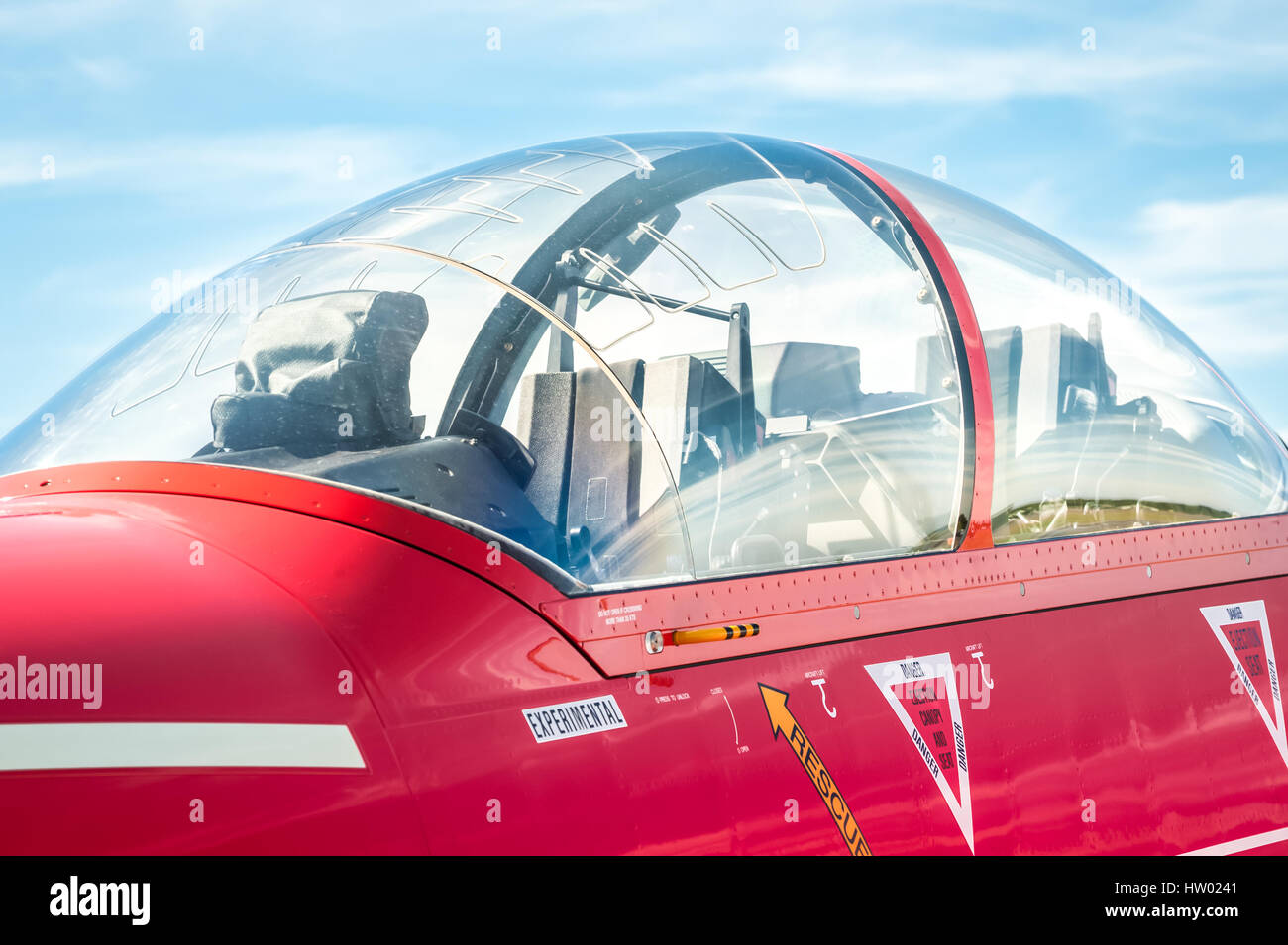 closeup of a airplane canopy reflecting blue sky Stock Photo