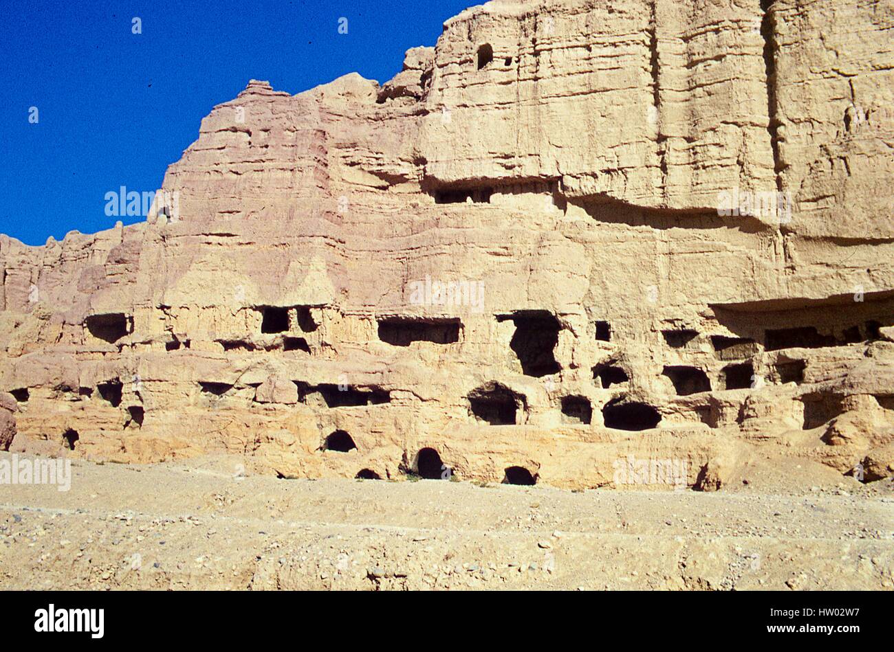 View of ancient caves cut into the hillside at Bamiyan, in the Hazarajat region of central Afghanistan, November, 1975. Stock Photo
