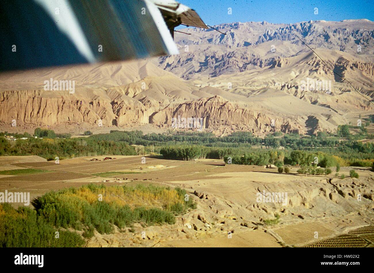 Aerial view of the cliffs lining the valley town of Bamiyan, in the Hazarajat region of central Afghanistan, November, 1975. Stock Photo