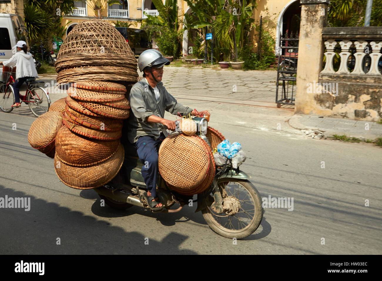 Motorcycle loaded with cane baskets, Hoi An (UNESCO World Heritage Site), Vietnam Stock Photo
