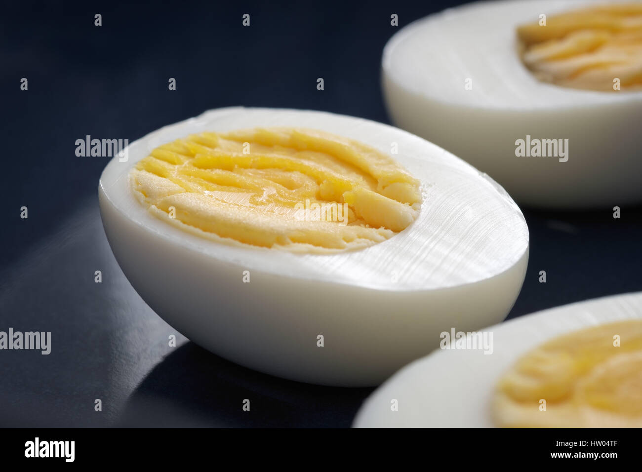 Three halves of boiled eggs Stock Photo