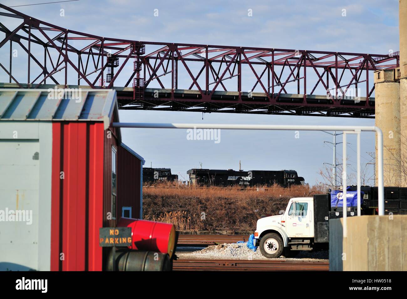 Chicago, Illinois, USA. A Norfolk Southern Railroad freight train making its way through a heavily industrial area on the southeast side of the city. Stock Photo