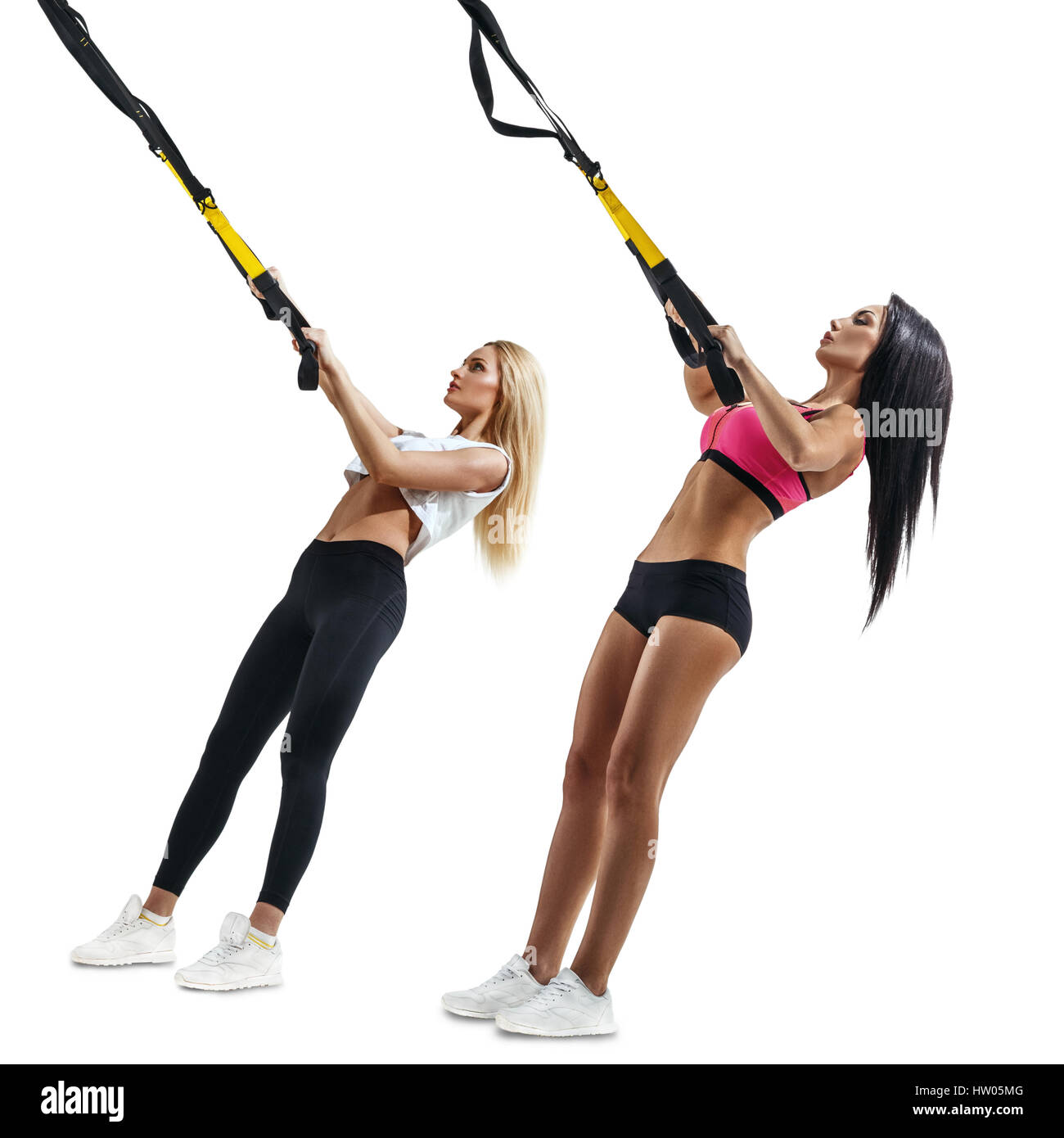https://c8.alamy.com/comp/HW05MG/brunette-and-blonde-fitness-women-do-thrust-with-trx-suspension-workout-HW05MG.jpg