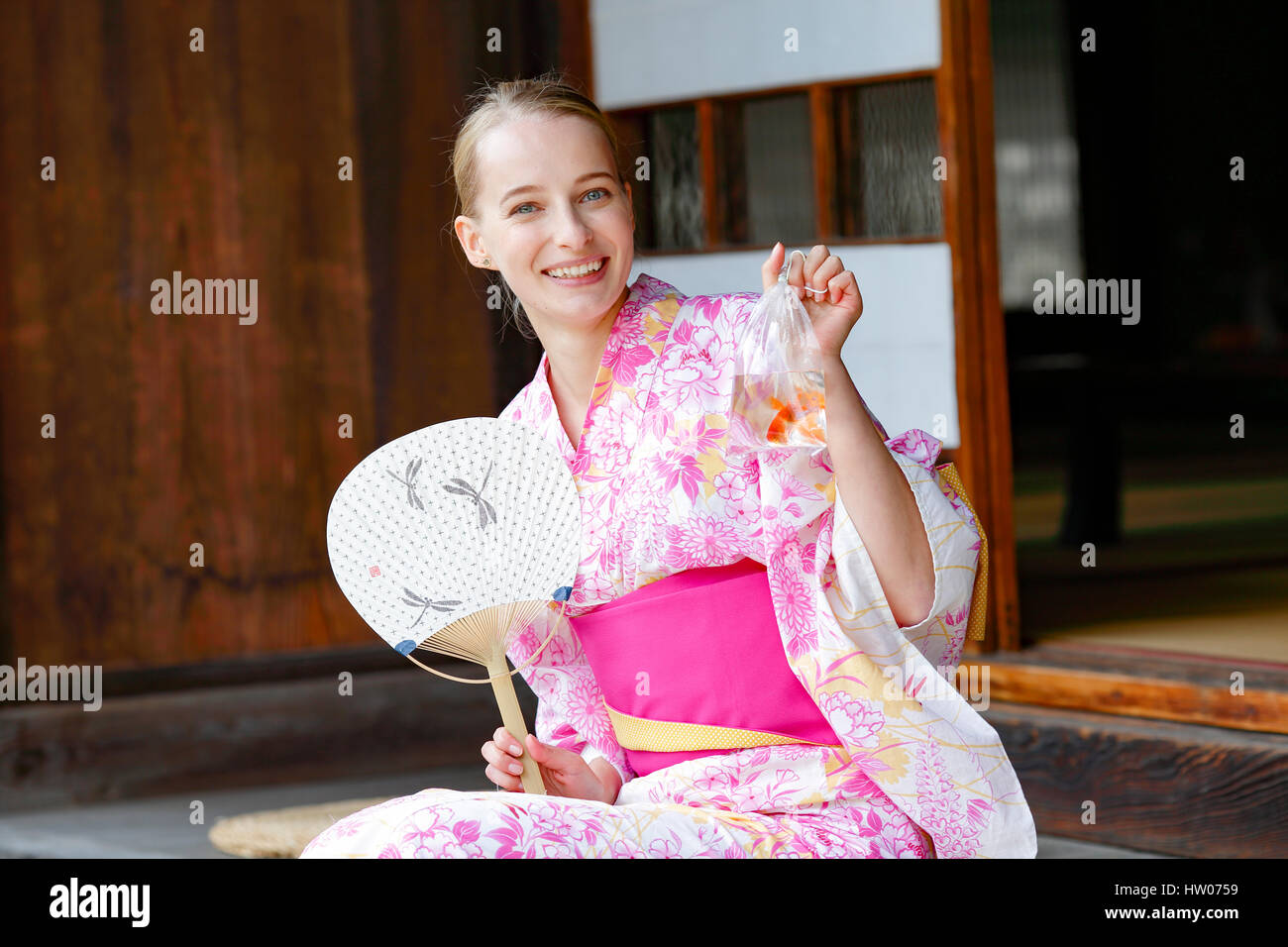 Caucasian woman wearing yukata in traditional Japanese house Stock Photo