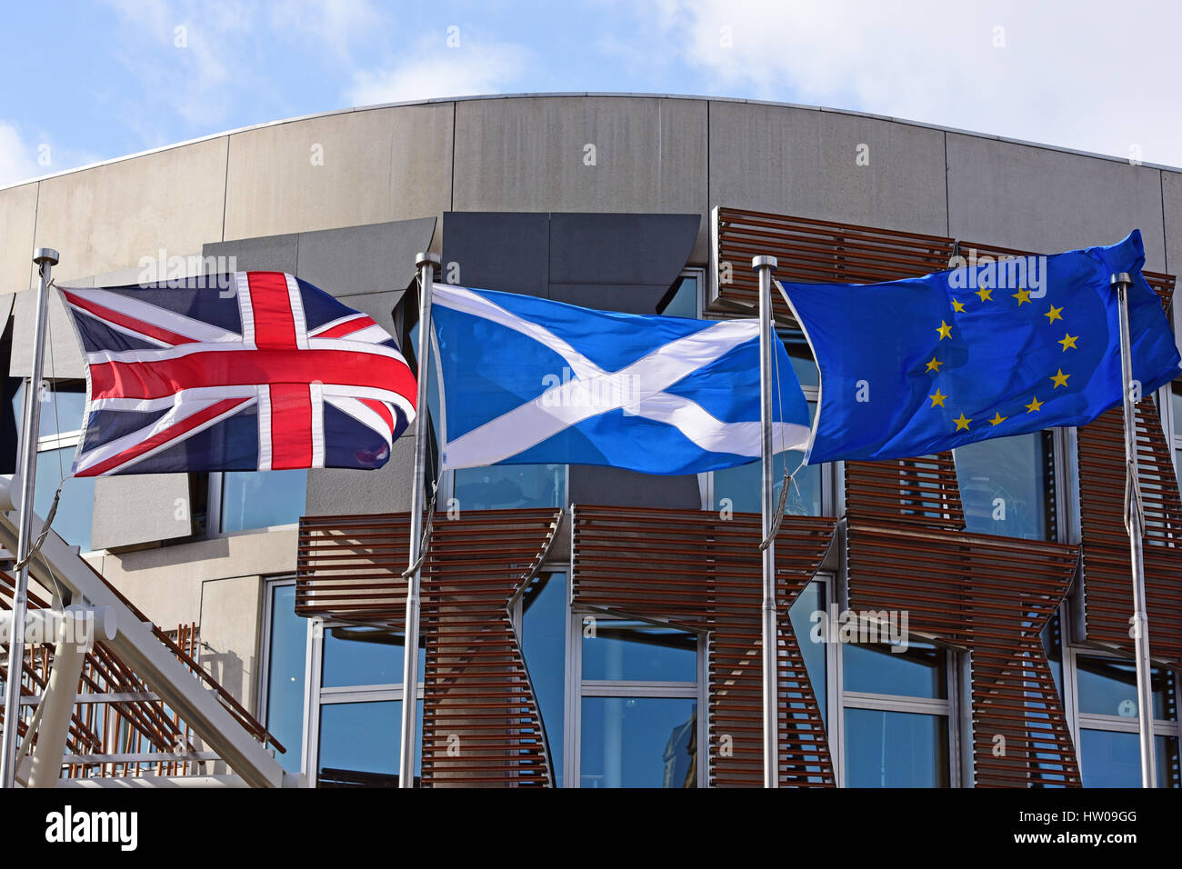 Edinburgh, Scotland, UK. 14th March 2017. The union flag, Scottish saltire, and flag of the European Union fly outside the Scottish Parliament on the day after First Minister Nicola Sturgeon announced she will seek approval to hold another referendum on Scottish independence, citing the UK Government's supposed reluctance to make a separate case for Scotland in Brexit negotiations, Credit: Ken Jack/Alamy Live News Stock Photo