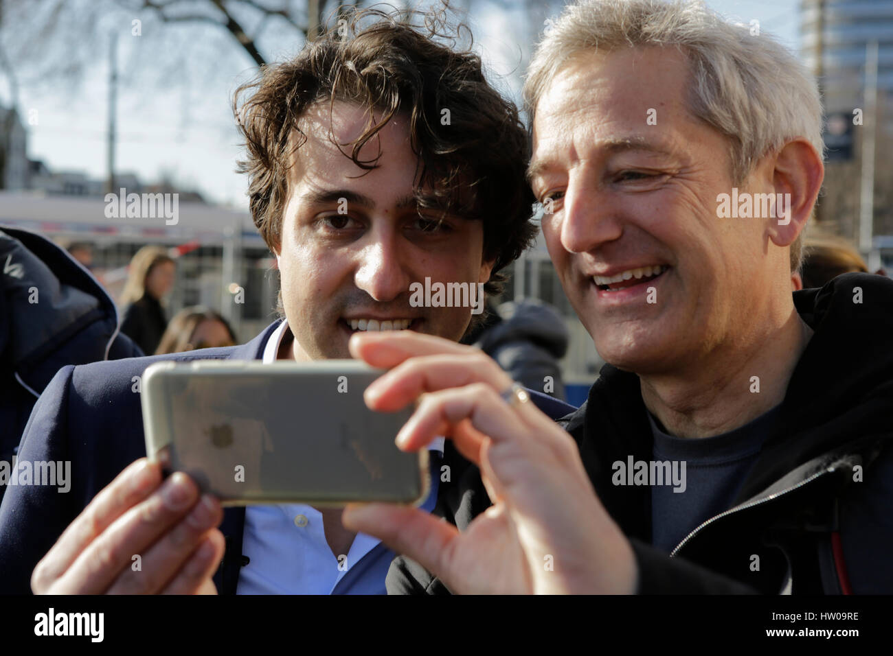 Amsterdam, Netherlands. 15th March 2017. Jesse Klaver gets a selfie taken with a voter. Jesse Klaver, the party leader of the GroenLinks, canvassed together with a number of GroenLinks volunteers outside of Amsterdam Central Station, to pursue undecided voters, to vote for his party in the Dutch general election. Credit: Michael Debets/Alamy Live News Stock Photo