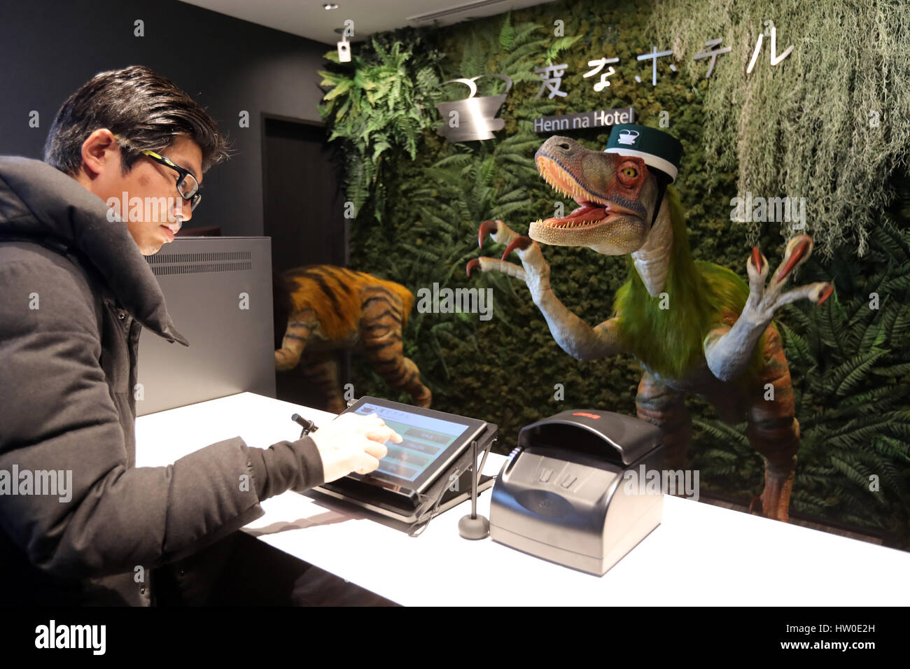 Tokyo, Japan. 15th March 2017. Urayasu, Japan. 15th Mar, 2017. A dinosaur robot greets a guest at a reception of the newly opened 'Henn na Hotel' (Strange hotel) near Tokyo Disney Resort in Urayasu, suburban Tokyo on Wednesday, March 15, 2017. Japan's travel agency H.I.S runs the Henn na Hotel which has only seven human employees while nine types 140 robot staffs work at the 100-room six-storey hotel. Credit: Aflo Co. Ltd./Alamy Live News Stock Photo