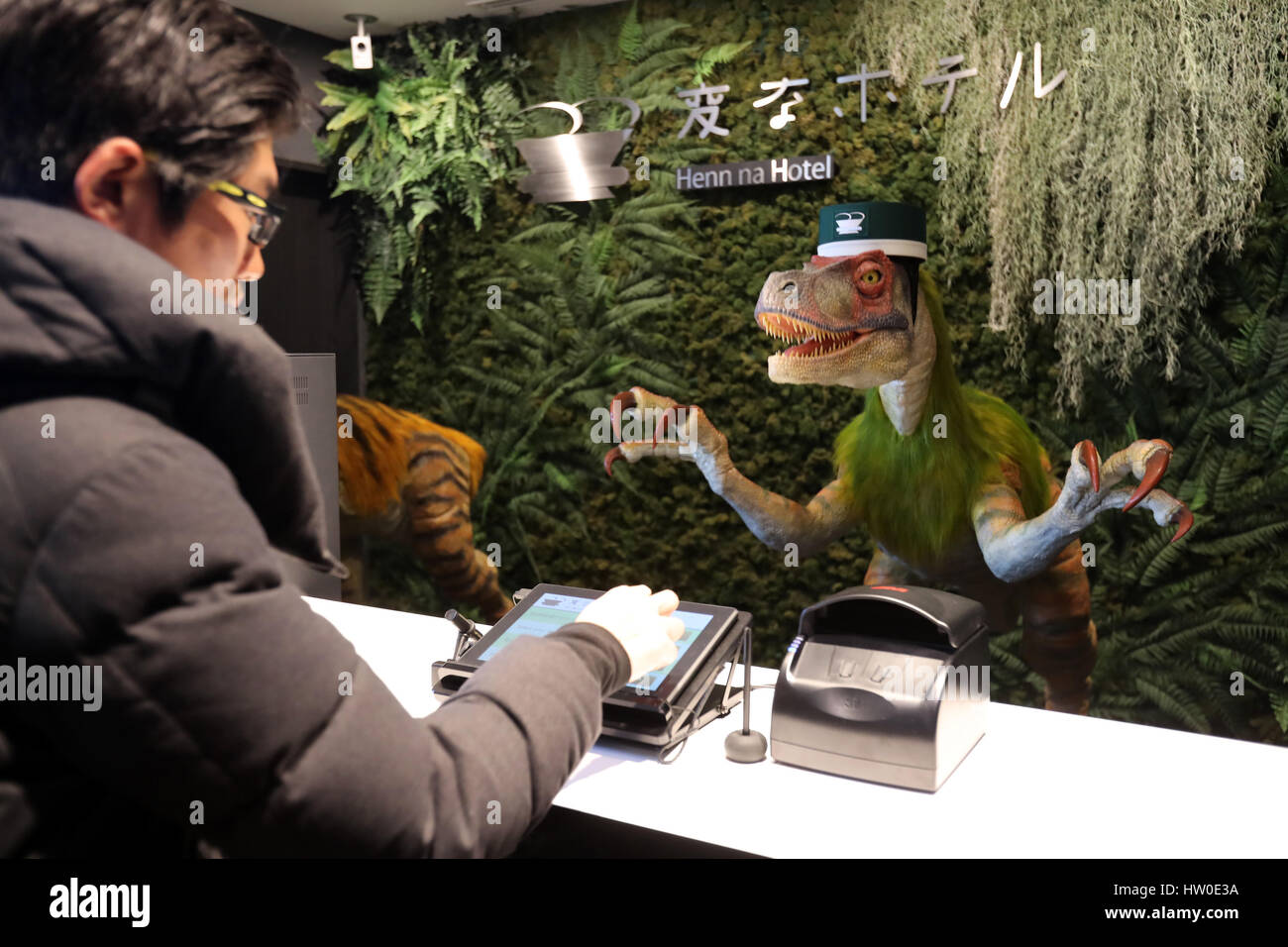 Tokyo, Japan. 15th March 2017. Urayasu, Japan. 15th Mar, 2017. A dinosaur robot greets a guest at a reception of the newly opened 'Henn na Hotel' (Strange hotel) near Tokyo Disney Resort in Urayasu, suburban Tokyo on Wednesday, March 15, 2017. Japan's travel agency H.I.S runs the Henn na Hotel which has only seven human employees while nine types 140 robot staffs work at the 100-room six-storey hotel. Credit: Aflo Co. Ltd./Alamy Live News Stock Photo