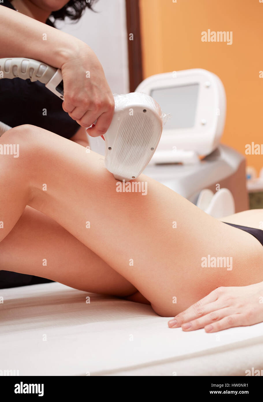 Woman getting laser face treatment in medical spa center Stock Photo