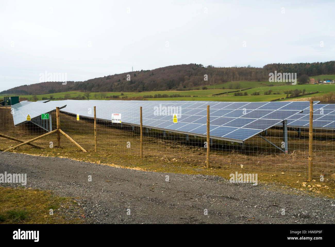 Small eco-friendly Solar Power generating panels on agricultural land in North Yorkshire Stock Photo