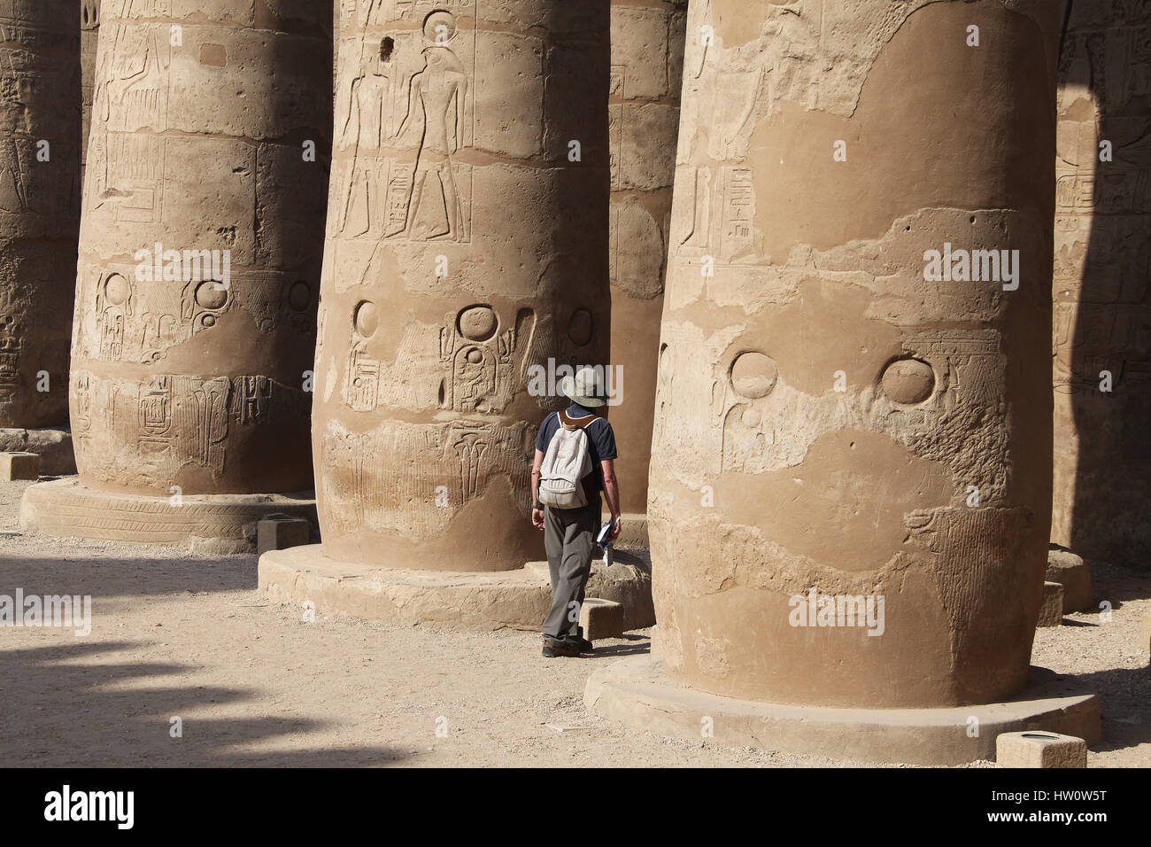 Tourist in the Courtyard of Rameses ll at Karnak Temple in Luxor Stock Photo
