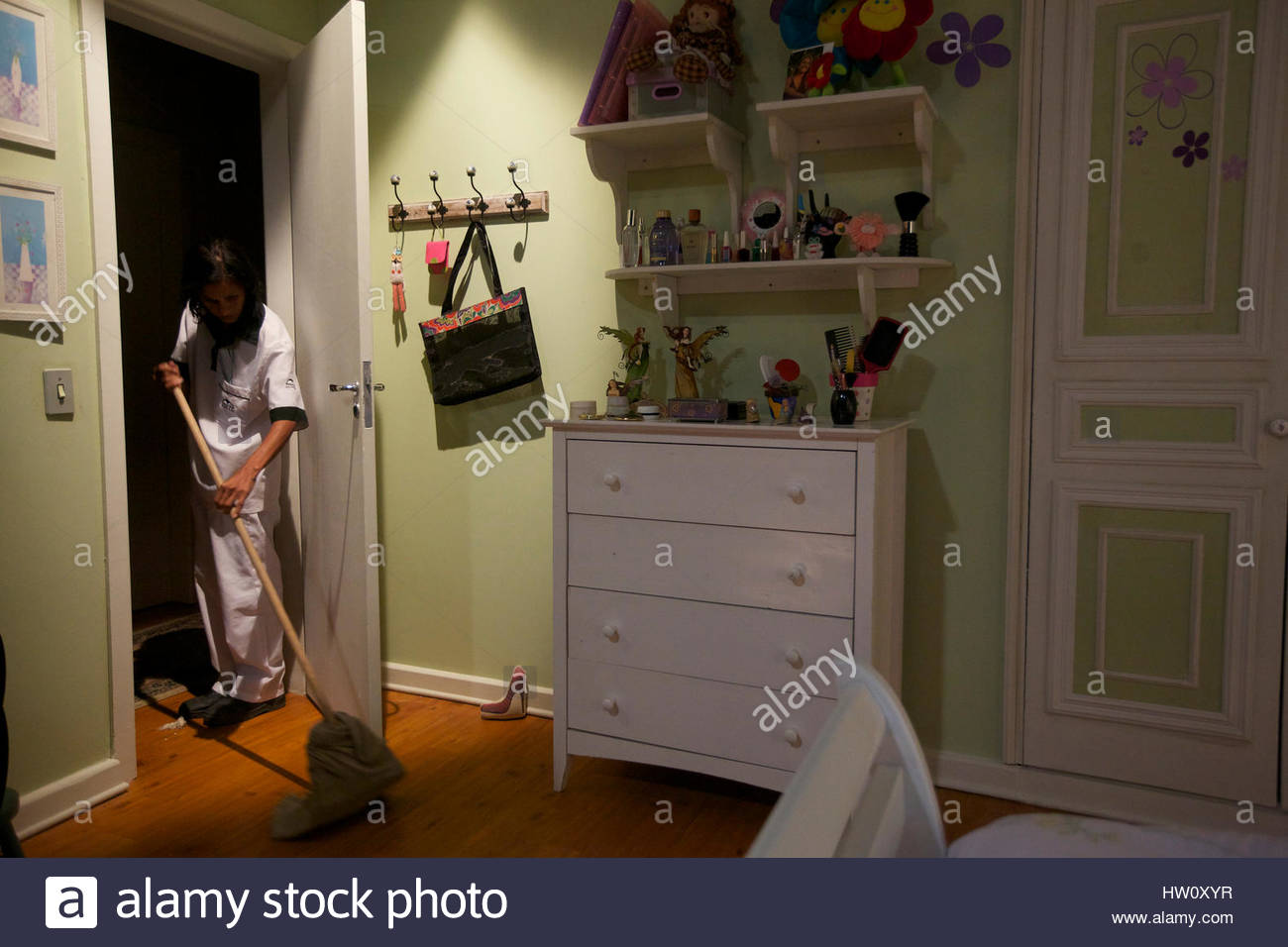 A Cleaning Women At Record Studios Mops The Floor Of A