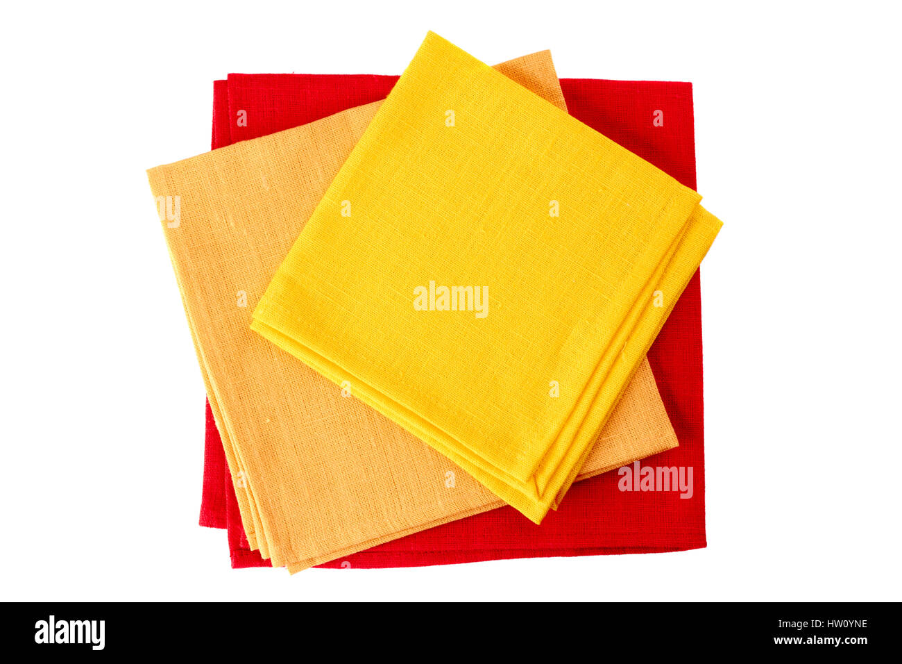 Three colorful textile napkins on white Stock Photo - Alamy