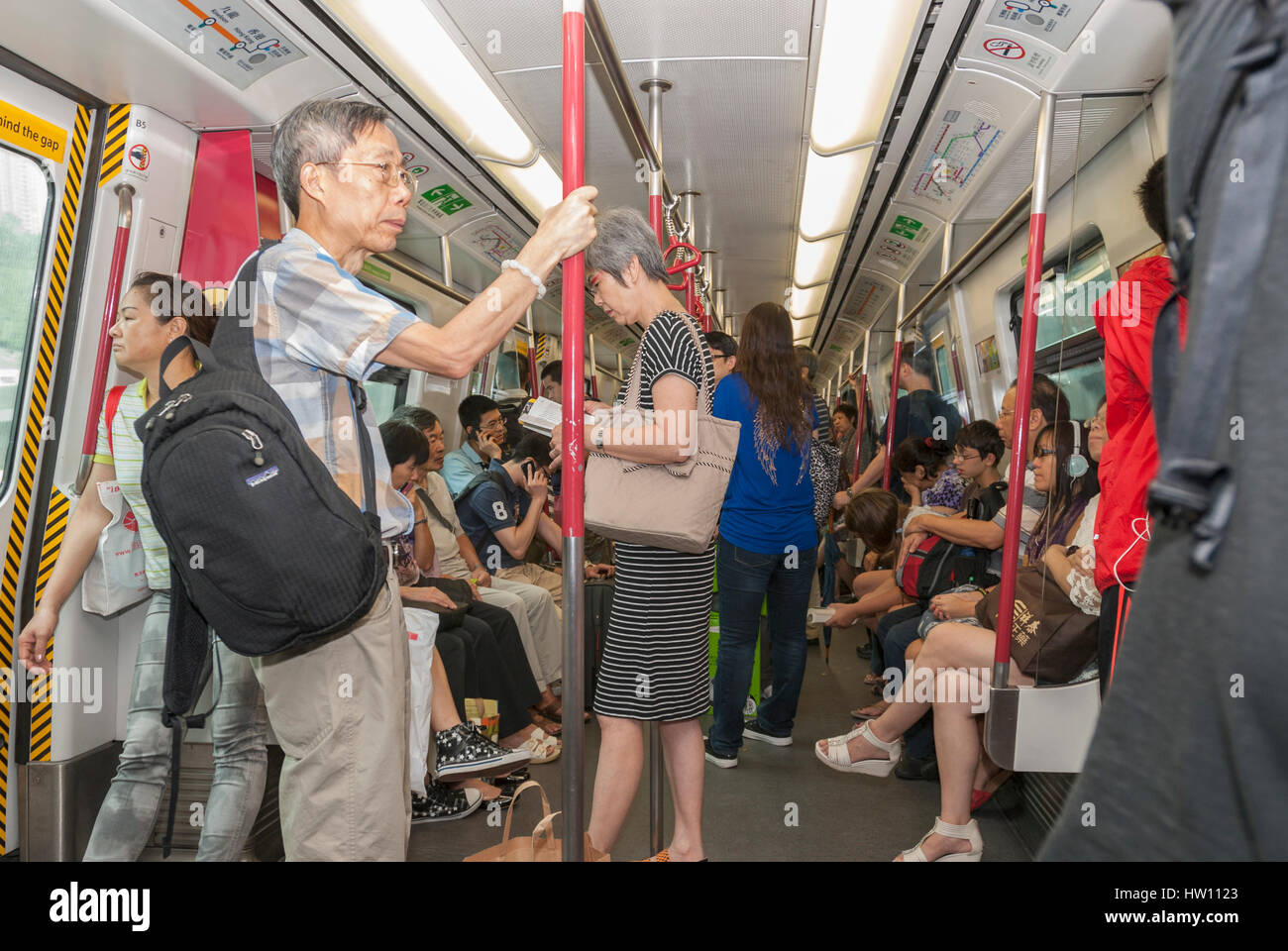 Passengers inside a MTR subway car, Hong Kong, China Stock Photo - Alamy