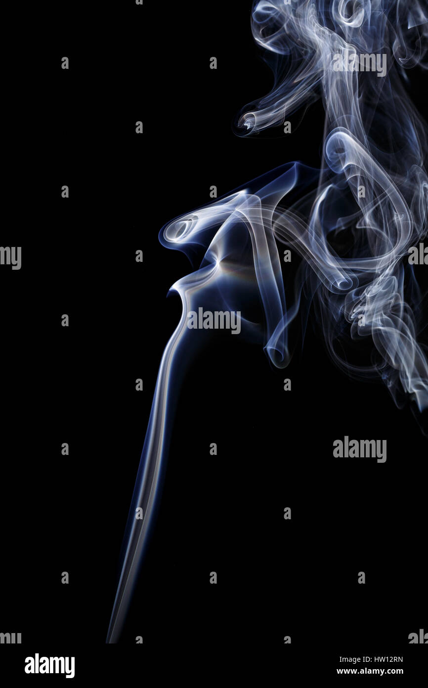 Abstract art. Color white blue smoke from the aromatic sticks on a