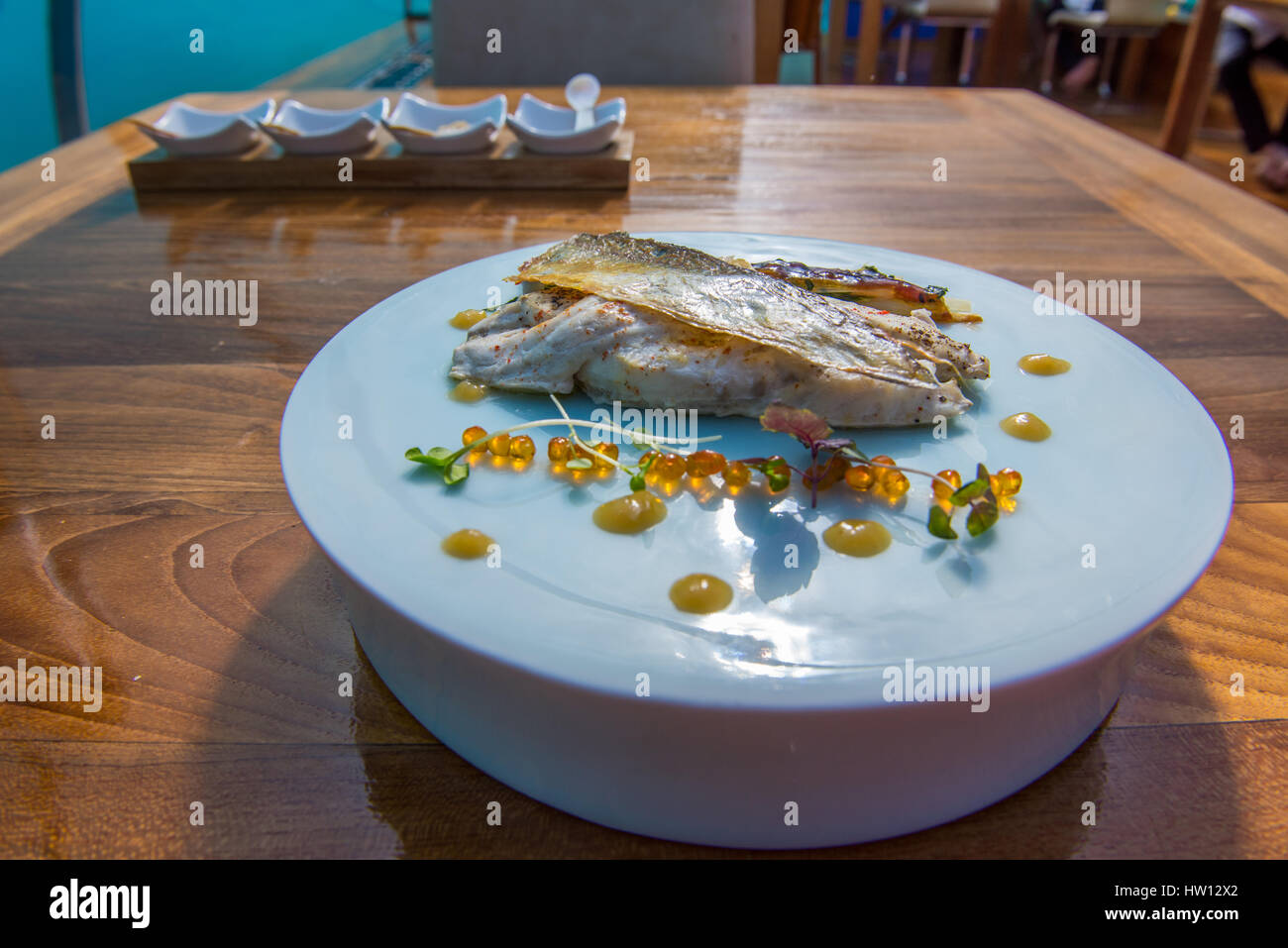 Maldives, Rangali Island. Conrad Hilton Resort. Sea Bream fish served at Ithaa underwater restaurant. Stock Photo