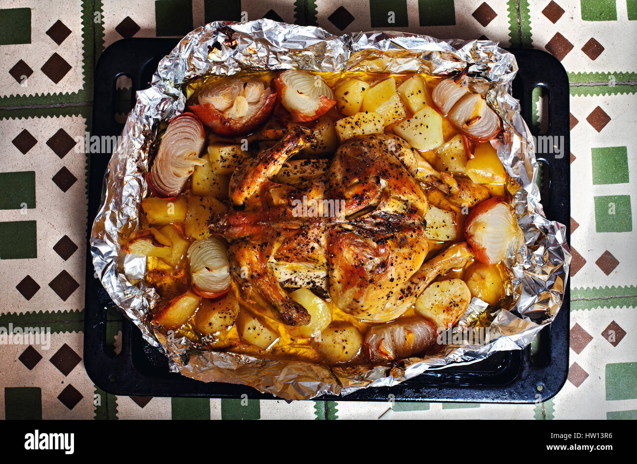 Roast chicken, potatoes and onions Stock Photo Alamy