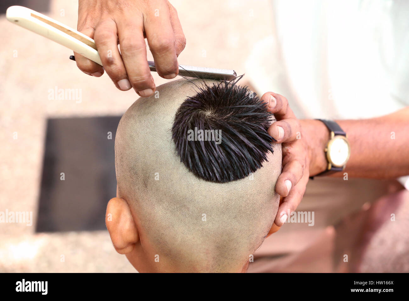 Getting a hair-cut for thread ceremony, Upanayana, a Hindu ritual performed  only for man in his childhood Stock Photo - Alamy