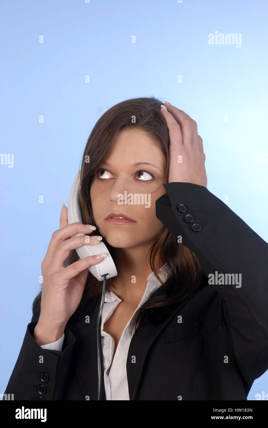 Young woman is with call up irritated, Junge Frau ist beim telefonieren genervt Stock Photo