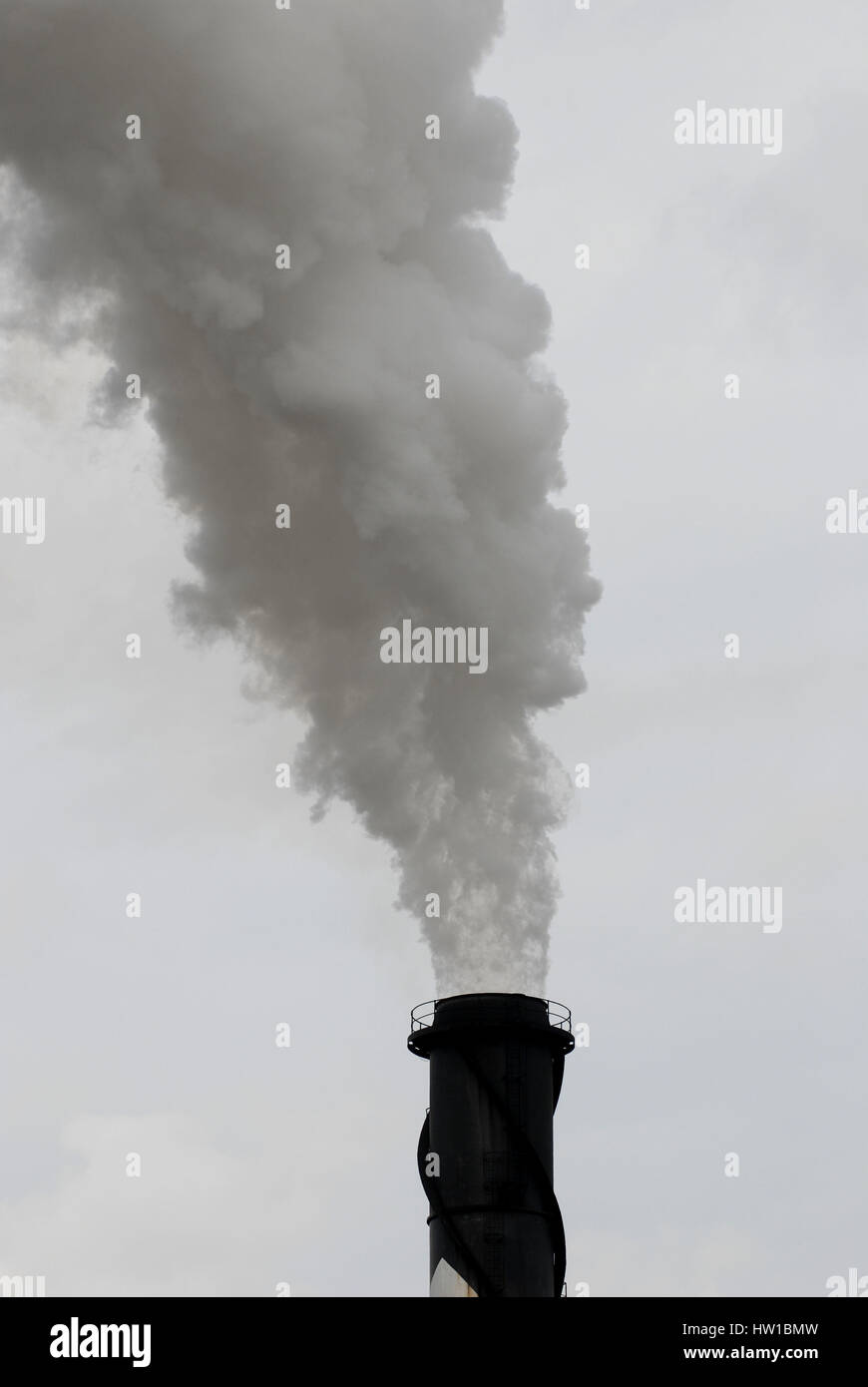 smoking industrial chimney, rauchender Industriekamin Stock Photo