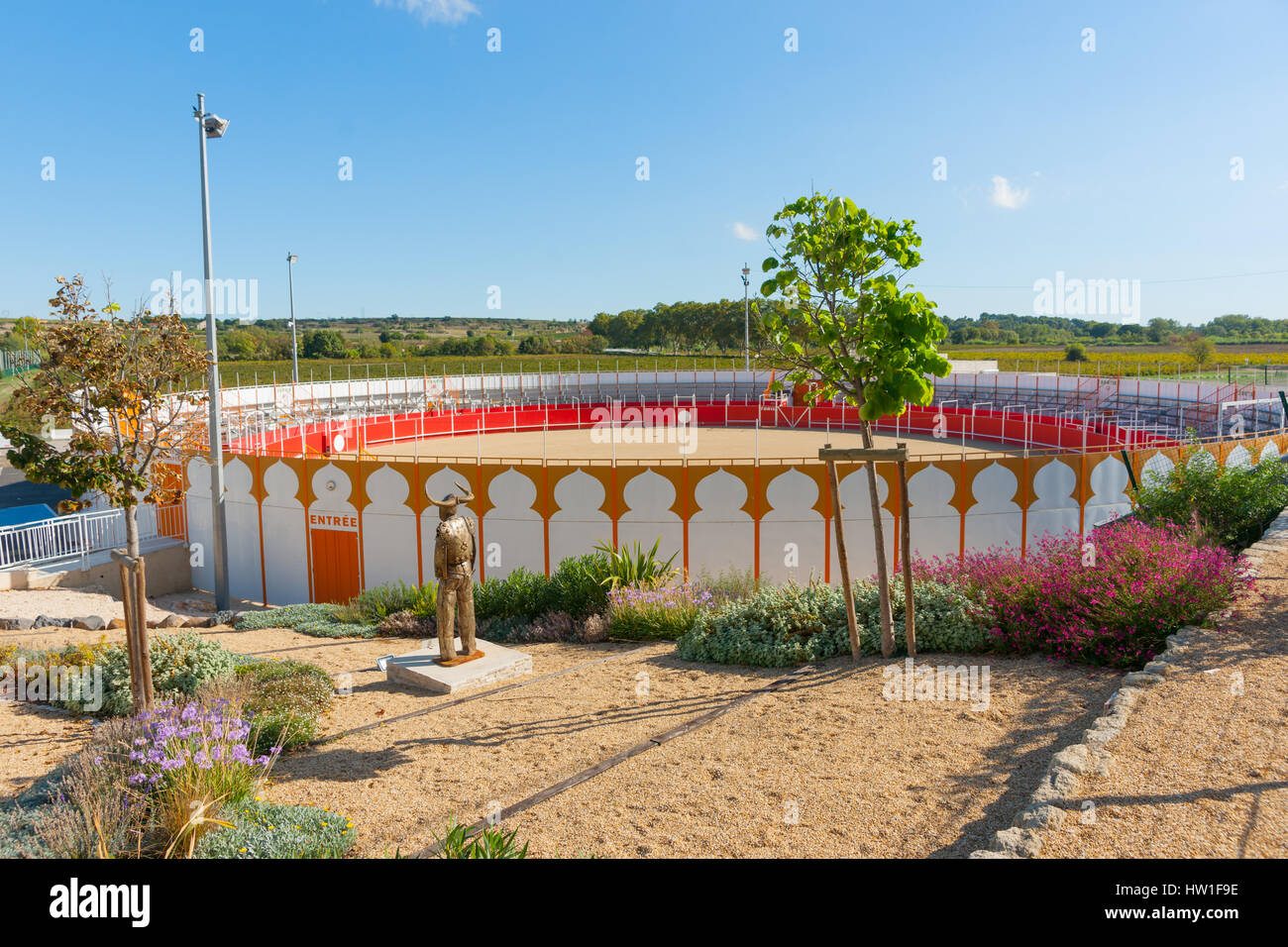 Modern bullring with matador statue on outskirts of small French town of Boujan Sur Libron , France Stock Photo