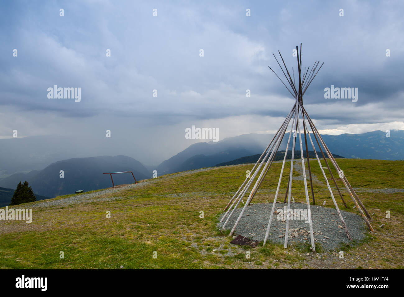 Typical American teepii on the hill before storm. Summer landscape in Gerlitzen Apls, Austria. Stock Photo