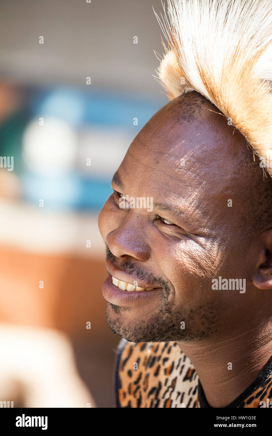 Lesedi Cultural Village, SOUTH AFRICA - 4 November 2016: Portrait of a Zulu Warrior wearing impala skin headdress. Zulu is one of the five main tribes Stock Photo