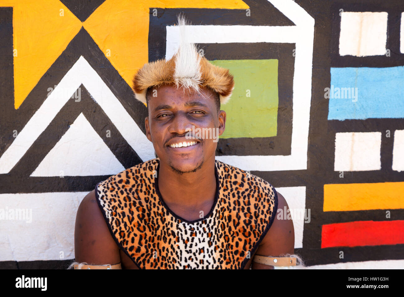 Lesedi Cultural Village, SOUTH AFRICA - 4 November 2016: Portrait of a Zulu Warrior wearing impala skin headdress. Zulu is one of the five main tribes Stock Photo