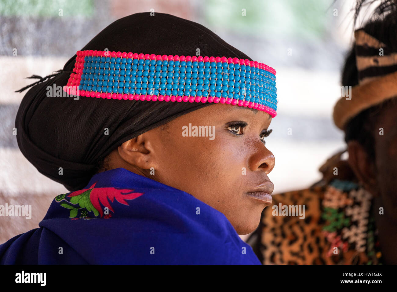 Lesedi Cultural Village, SOUTH AFRICA - 4 November 2016: Portrait of a young Zulu woman in colourful traditional bead work costume. Stock Photo
