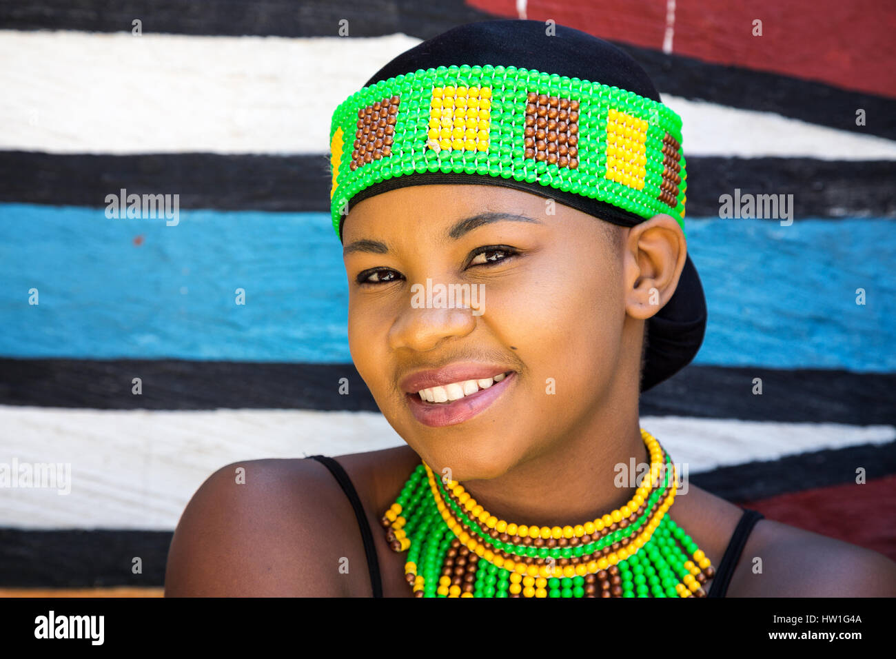 Lesedi Cultural Village, SOUTH AFRICA - 4 November 2016: Young Zulu woman in colourul traditional bead work costume. Stock Photo